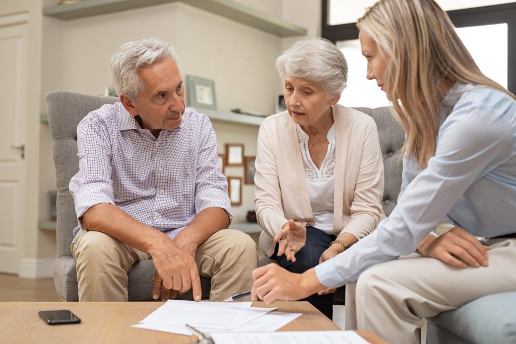 A senior couple consult with their estate planning attorney at Clearwater Law Group to finalize their estate ahead of retirement, while neither of them have a memory-related disease.